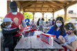 Residents Work Around a Table Building Birdhouses 2