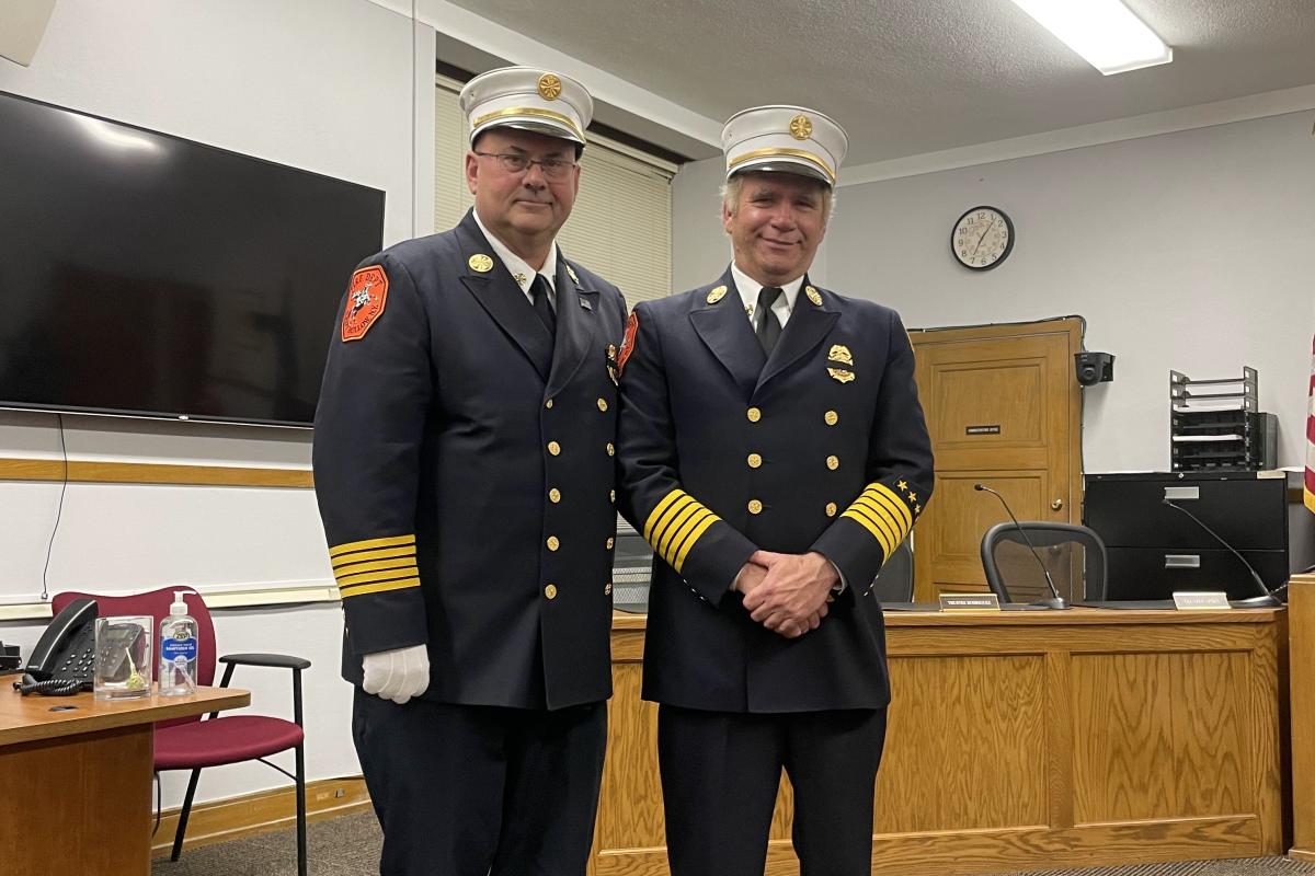 Two Officers Take a Group Photo Together 2