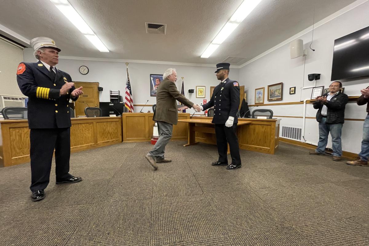 Officiant Shaking the Hand of a Newly Sworn in Officer