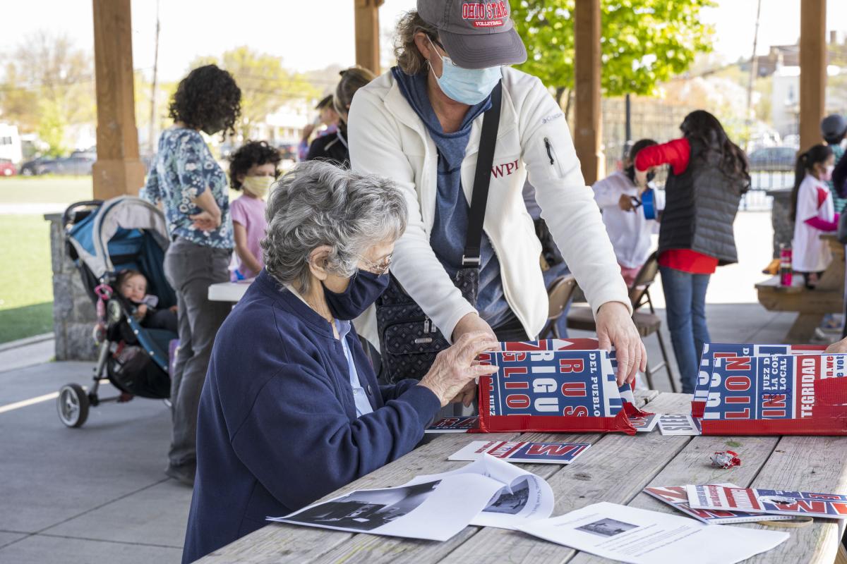 Woman Assisting an Elder with Her Birdhouse Project 3