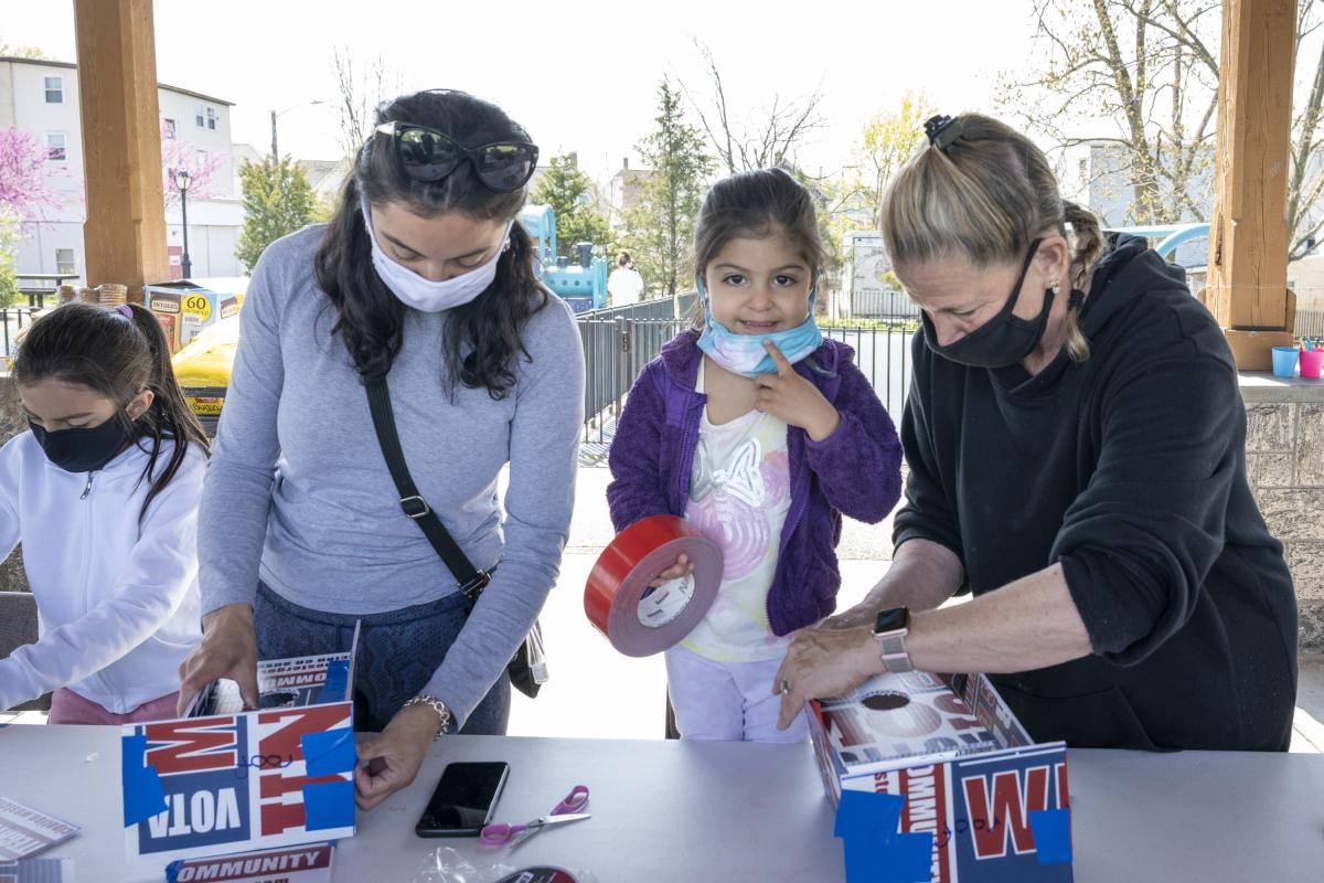 Residents Taping Birdhouses Together