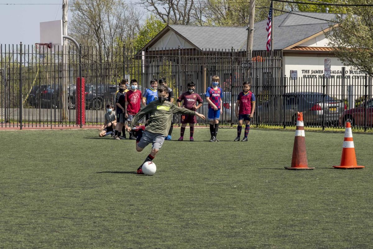 Kid Kicking a Soccer Ball 4