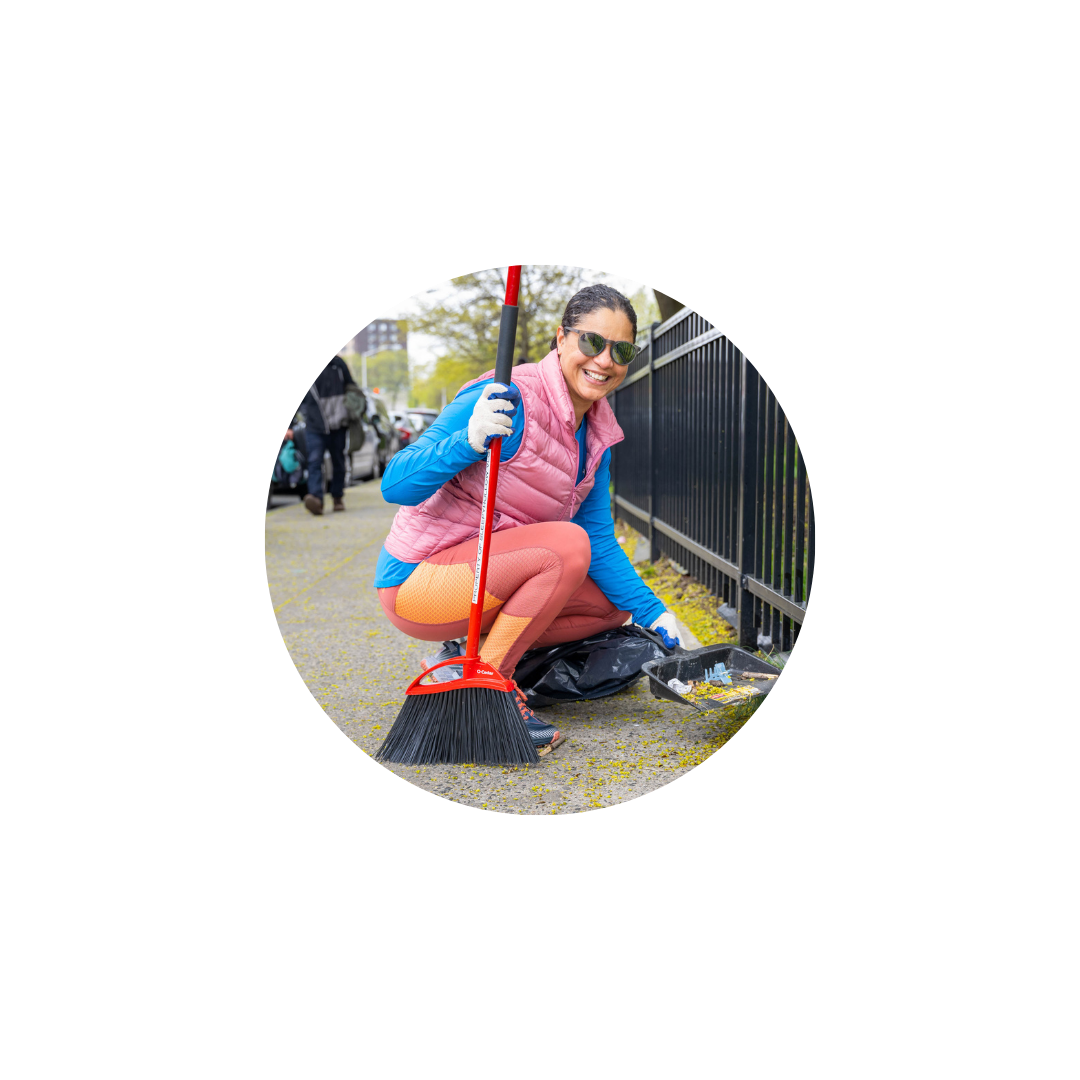 Woman cleaning sidewalk