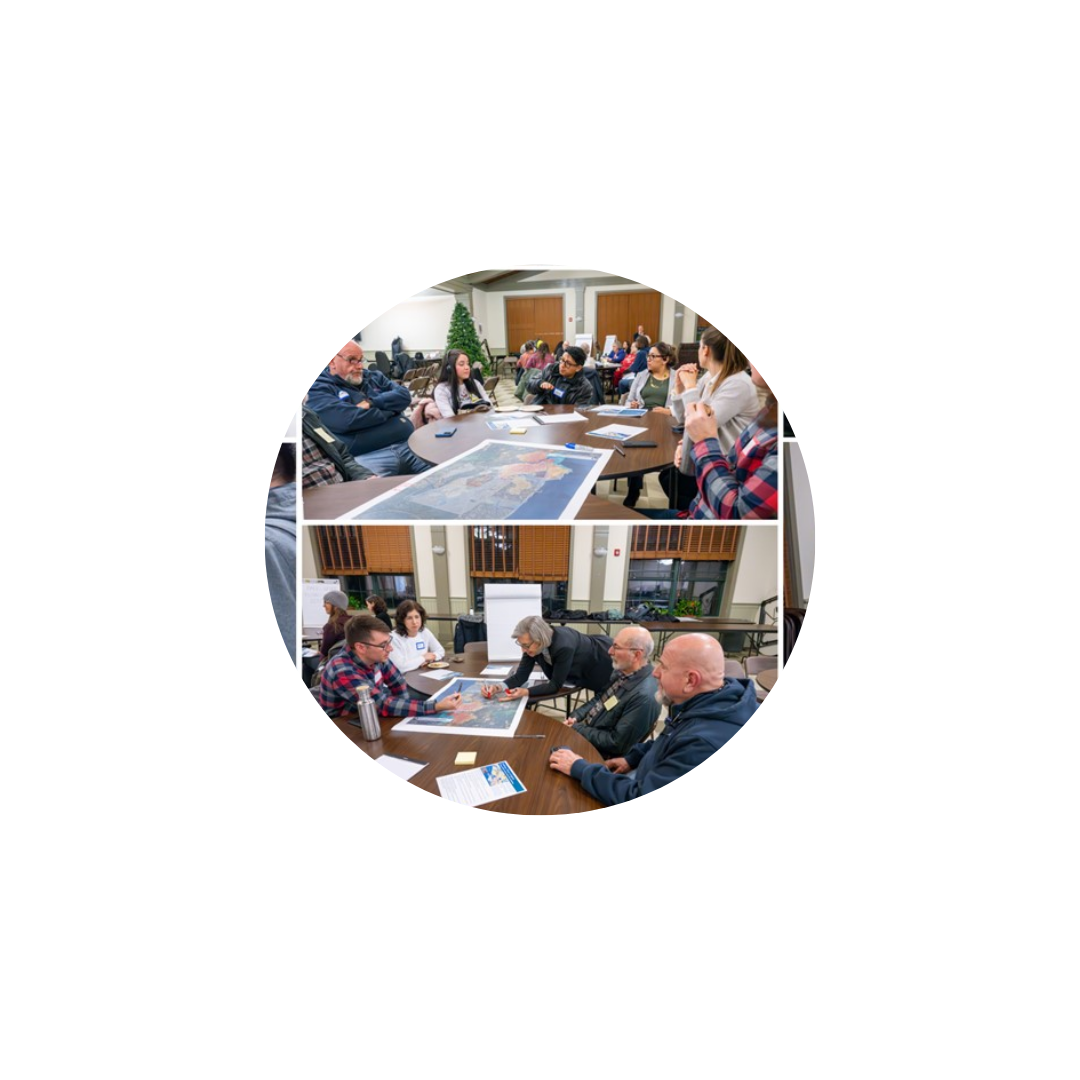 residents sitting at tables reviewing documents